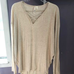 Cream colored long sleeve top